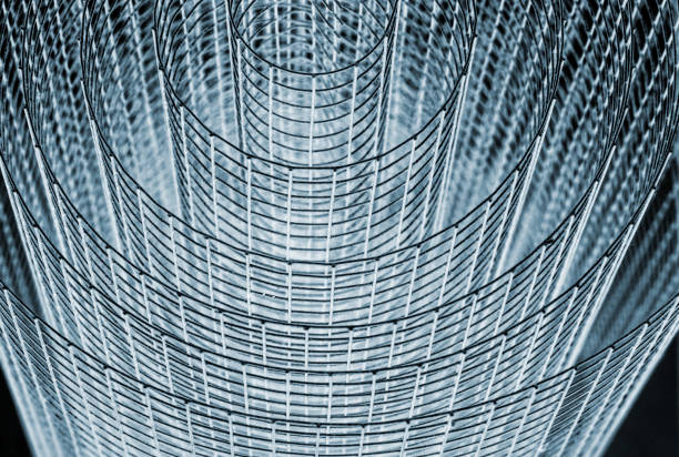 Abstract spiral metal coiled wire mesh with grid pattern, geometric symmetry, modern minimal design for industrial construction, diy, architectural concepts. Isolated on white background. Copy space