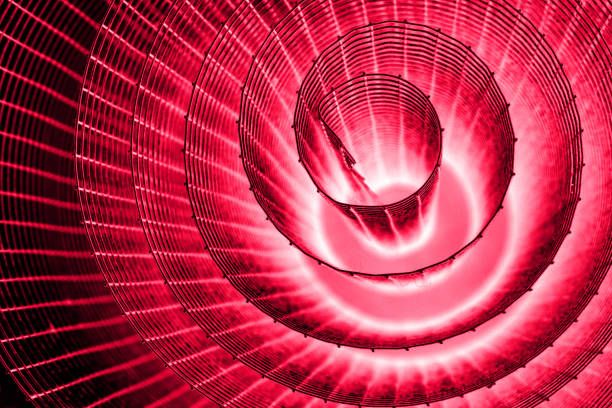 istock Abstract spiral with glowing pink purple wire texture against a black background, symbolizing color contrast, energy, motion, industrial and futuristic design concepts. Copy space 2190607335