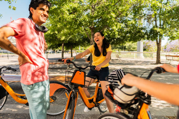 istock Cyclist friends talking on the public park 2190608620
