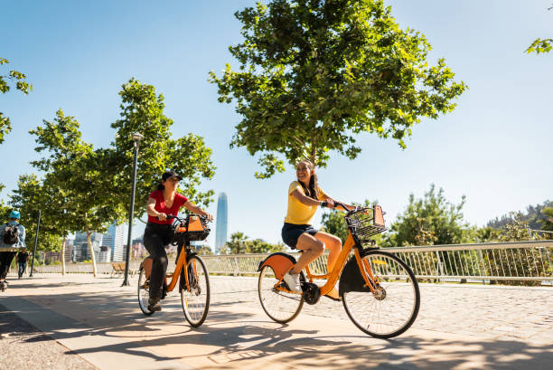 istock Friends cycling and talking on the public park 2190608701
