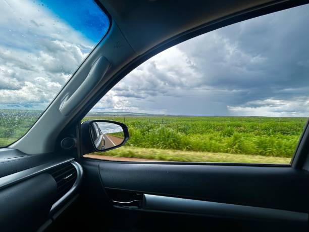 istock Beautifull rain cloud on soybean crop agriculture. Vision inside car window 2190608866