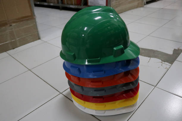 istock A stack of colorful helmets or hard hats 2190617369