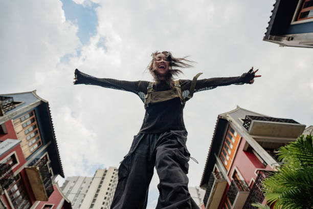 Two female dancers practicing a modern dance choreography outdoors, showcasing flexibility, balance, and creative movement