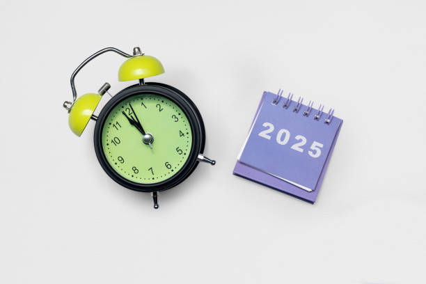istock Calendar or Notepad with the number 2025 and alarm clock on a white background 2190623133