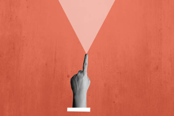 istock A human hand with a gesture of pointing ahead on a colored background 2190623158