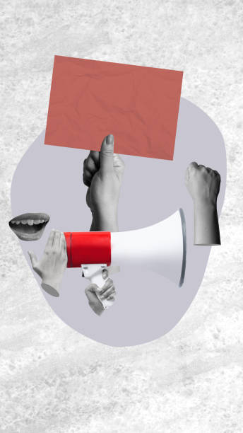 istock A human hand talking on a megaphone and holding a ballot paper on a colored background 2190623331