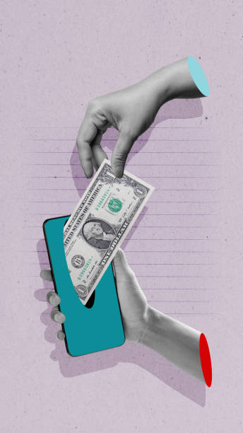 istock A human hand takes a dollar banknote through a mobile phone screen with a colored background 2190623343