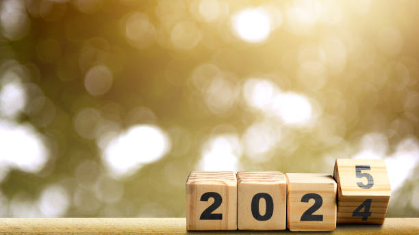 istock Wooden cubes transform from number 2024 to 2025 on the table 2190623510
