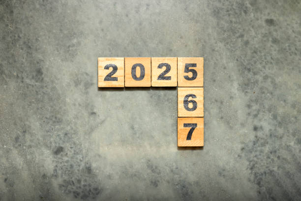 istock Wooden cubes with number 2025 on black background 2190623557