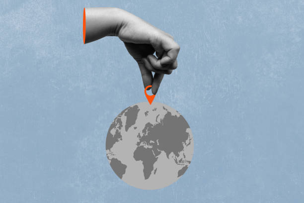 istock The human hand put a location pin on the globe with a colored background 2190624237