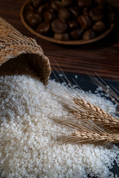 Rice poured out of a small bamboo basket in a dim light environment