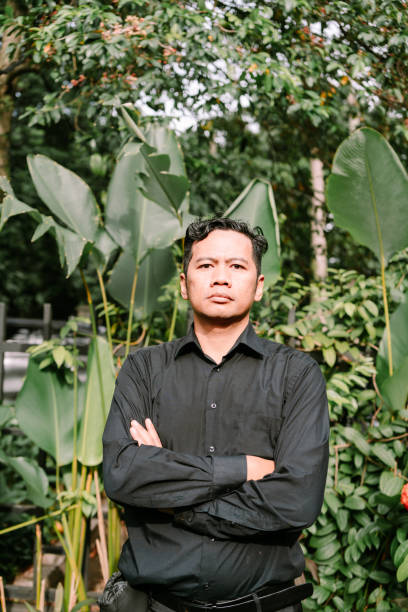 istock A Southeast Asian man standing confidently with his arms crossed 2190625556