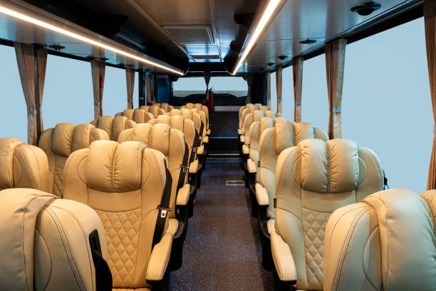 istock Inside bus with brown reclining seat row 2190628913