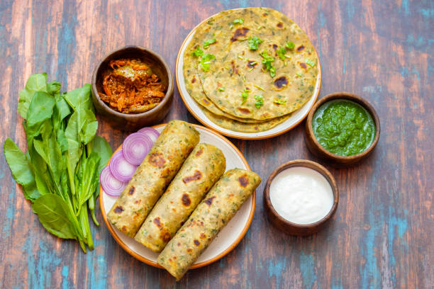 istock Palak paratha is a soft, spinach-filled flatbread, served with creamy, spiced palak paneer—a flavourful spinach and cottage cheese curry. 2190629247