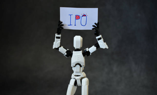 istock Robot model holding IPO placard having concept of Digital startup IPO. 2190631099