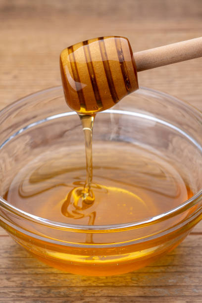 istock Honey Dripping from a Honey Dipper 2190636853