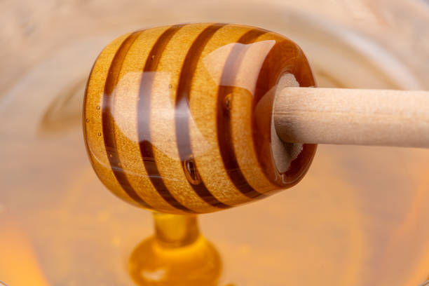 istock Honey Dripping from a Honey Dipper 2190636854