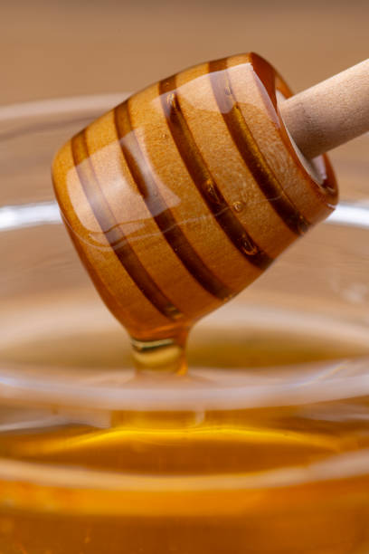 istock Honey Dripping from a Honey Dipper 2190636858