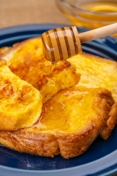 Pouring Honey Over French Toast