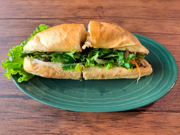 istock Delicious Chicken Banh Mi Is A Vietnamese Sandwich Bread Filled with Complementary Vegetables, Pate Sauce, Satay Sauce, Beef Floss and Grilled Chicken Marinated with Lemongrass Seasoning. Vietnam Food Menu. 2190637337