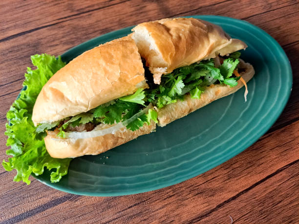 istock Chicken Banh Mi Is A Vietnamese Sandwich Bread Filled with Complementary Vegetables, Pate Sauce, Satay Sauce, Beef Floss and Grilled Chicken Marinated with Lemongrass Seasoning. Vietnam Food Menu. 2190637339