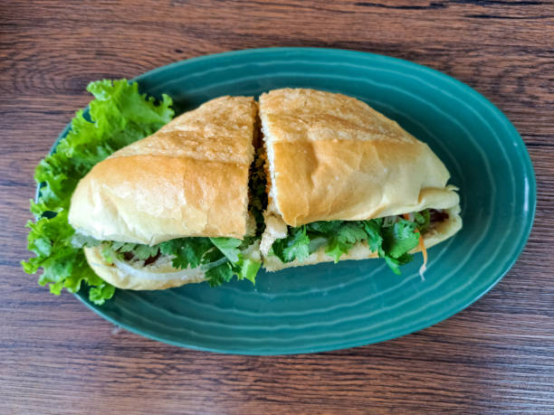 Delicious Chicken Banh Mi Is A Vietnamese Sandwich Bread Filled with Complementary Vegetables, Pate Sauce, Satay Sauce, Beef Floss and Grilled Chicken Marinated with Lemongrass Seasoning. Vietnam Food Menu. Top View.