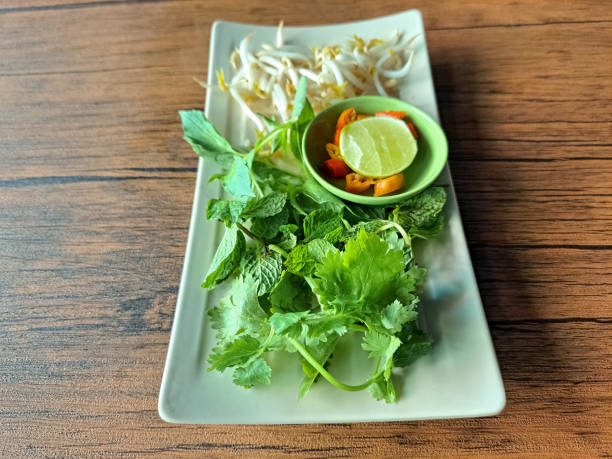 istock Ingredient For Pho Soup Is Bean Sprouts, Mint Leave, Coriander Leave, Asian Basil Leave, Sliced ​​Chili And Lime. 2190638044
