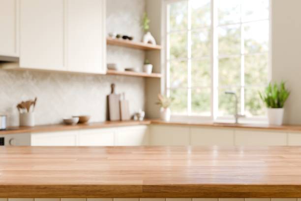 istock Wood counter top with blurred kitchen background. Bright, Modern Kitchen with Natural Light and Decor. 3d render. 2190638214