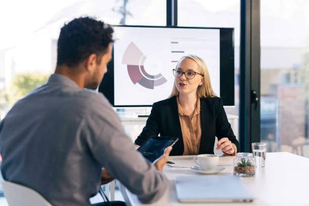 istock Professional Business Meeting in a Modern Office Setting with Colleagues Engaging in Discussion 2190639087