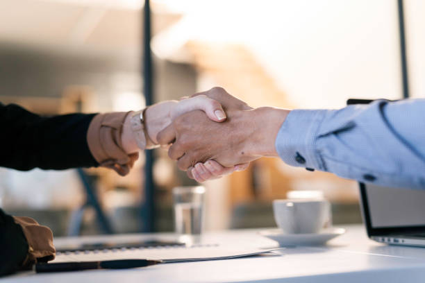 istock Professional Business Handshake at a Modern Workspace Signifying Trust and Agreement 2190639096