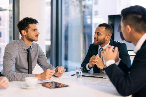 istock Dynamic Business Meeting with Diverse Team in Modern Office With Large Windows 2190639120