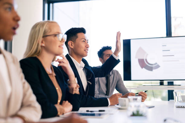 istock Diverse Team in a Business Meeting Engaged in Presentation Discussion 2190639154