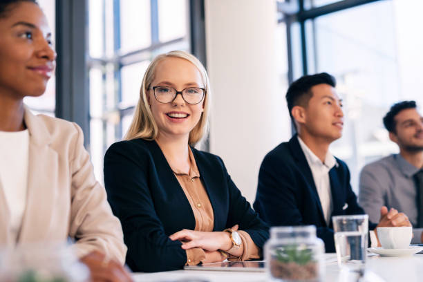 istock Confident Business Team Members Attending a Meeting in Modern Office Setting with Positive Energy 2190639157