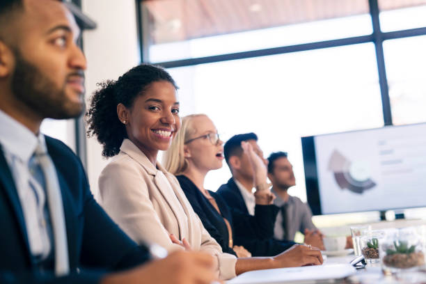 istock Diverse Group of Professionals Engaged in a Business Presentation in Modern Office Setting 2190639164