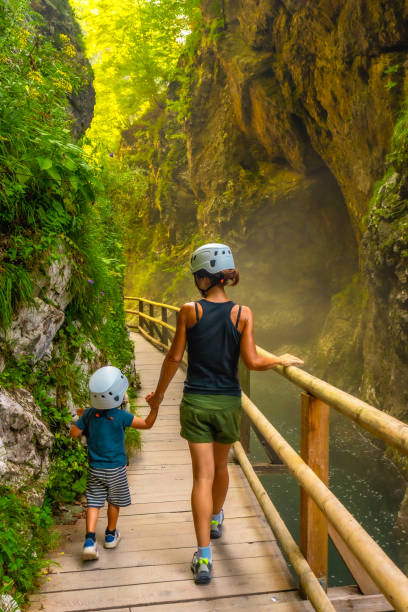 istock Mother and son exploring vintgar gorge in protective helmets 2190639969