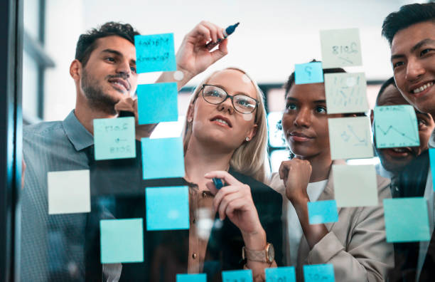 istock Group of Diverse Professionals Collaborating on a Strategic Plan in Office Setting 2190640336