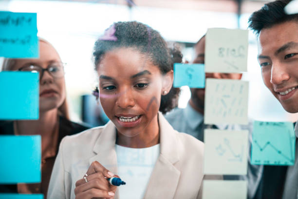 istock Creative Team Collaborating on New Business Strategies in an Office Setting 2190640348