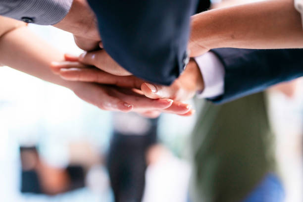 Top view of MultiEthnics Teamwork high five hands stack shakehand together. Collaboration Team Meeting in Conference Room. Diversity Partner Business Meeting brainstorm hand holding teamwork consult