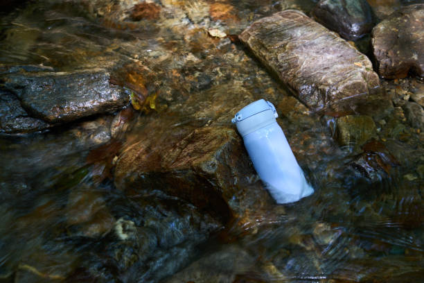 istock A light blue water bottle cooled by the flow of a mountain stream 2190645095