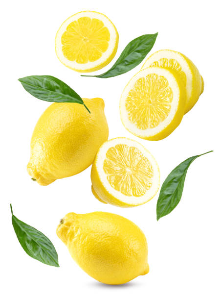 istock flying sliced lemon with green leaves isolated on white background. clipping path 2190645235