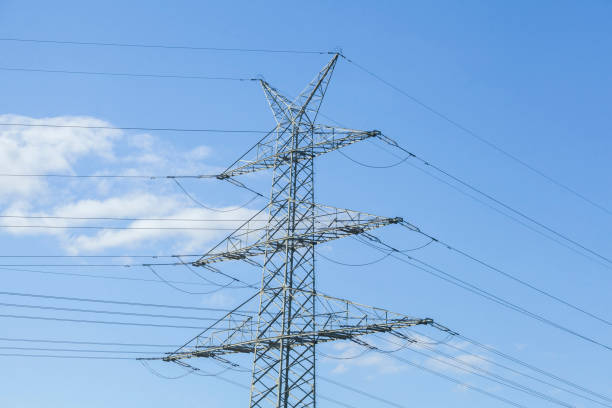 istock electricity pylon, power supply, energy supply, blue sky, Germany 2190647002