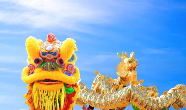 istock Chinese lion and Golden dragon dance performance parade against blue sky background during Chinese New Year Celebration Festival at Thailand 2190648022