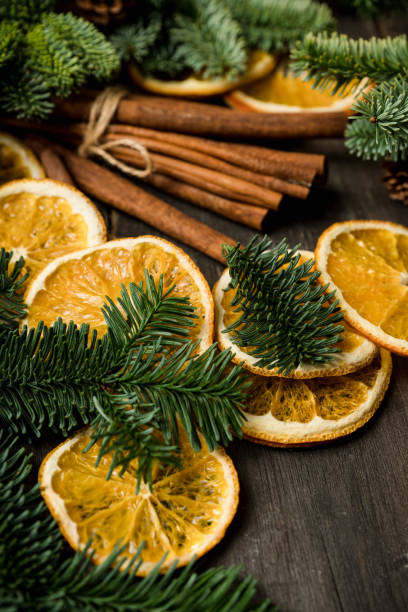 istock Dried oranges with spices on the rustic wooden background. Christmas mood. 2190649715