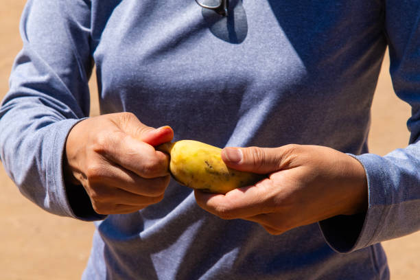 istock peeling a banana at the hand 2190649757