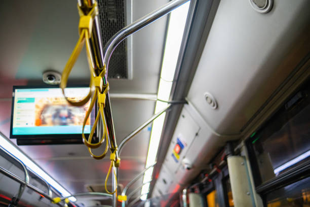 Modern public transport, offering comfortable urban travel, Spacious tram cabin with vibrant blue seats and yellow accents, Efficient urban mobility, bright and inviting interior design