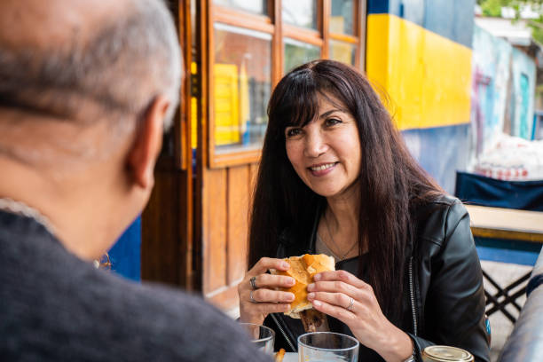 istock Couple talking and eating in a restaurant 2190652724