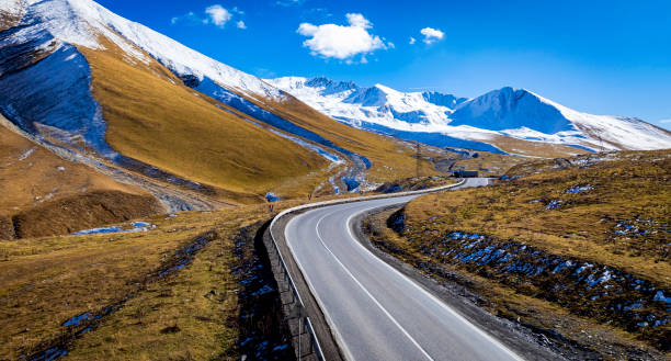 istock Aerial view  on the road surrounded by winter Landscape view 2190653481