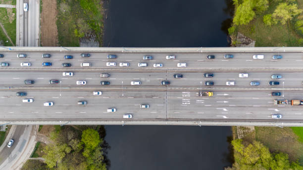 Aerial View of Busy Highway Bridge Over River