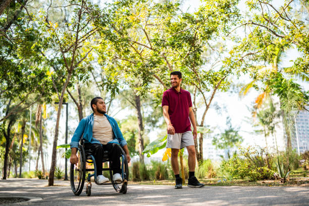 istock Friends talking and walking on public park 2190654062