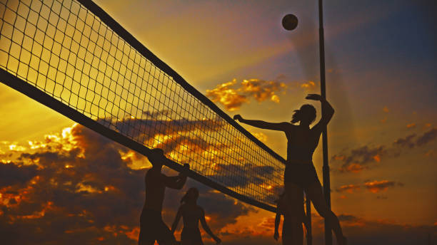 istock Joyful Beach Volleyball Game at Sunset 2190656654
